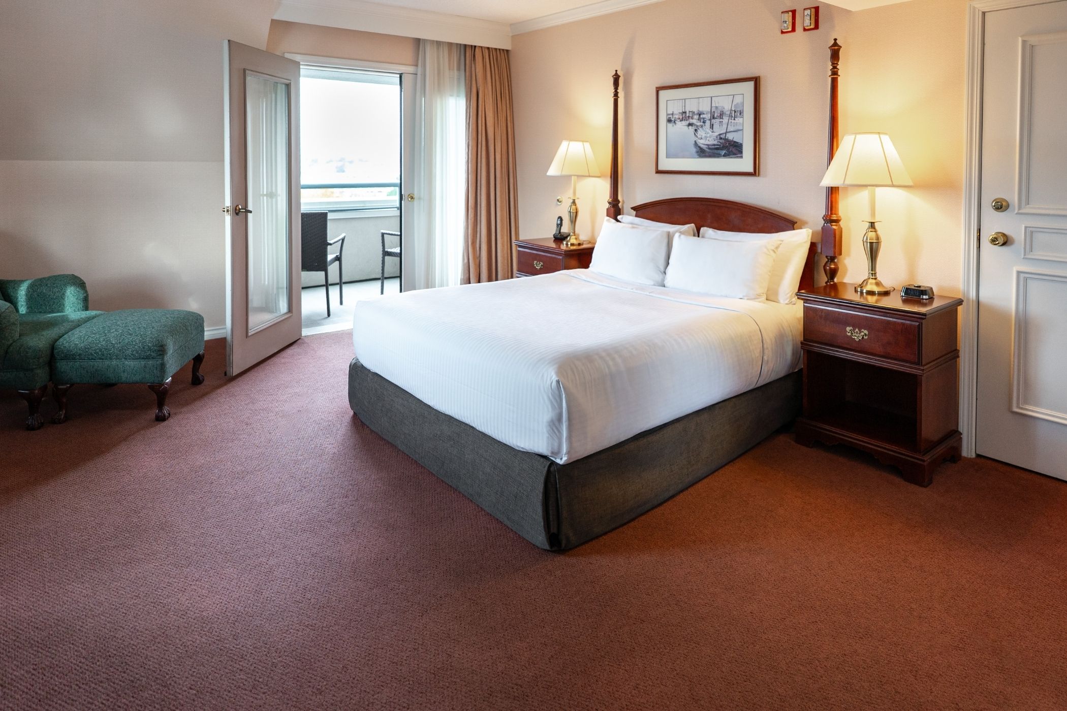 King bed with side tables and chairs