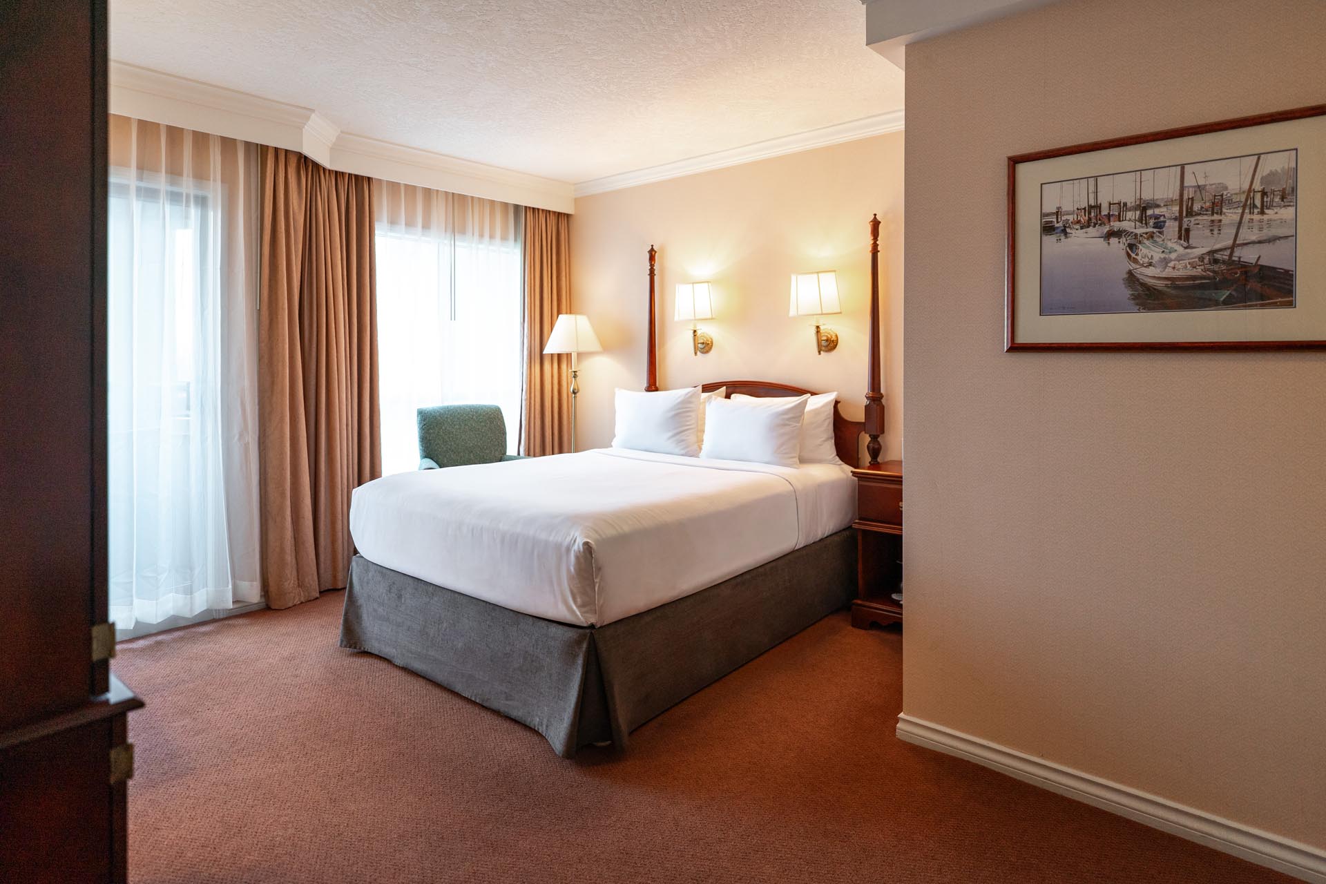 King bed beside large windows